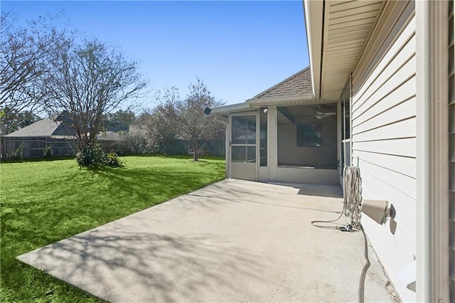 view of patio / terrace with a sunroom and a fenced backyard