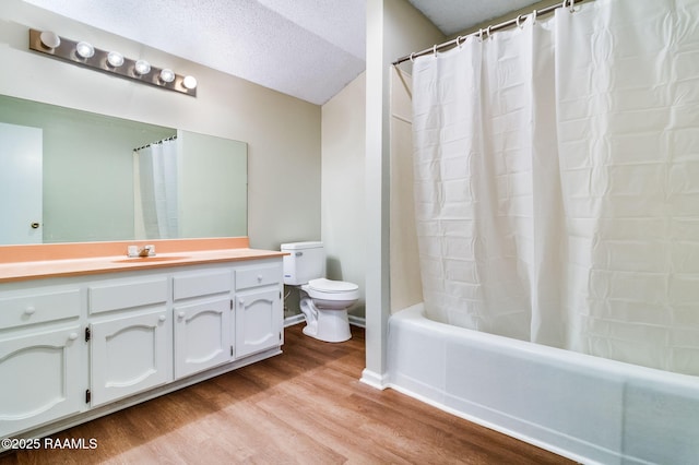 full bathroom with toilet, vanity, shower / bath combination with curtain, hardwood / wood-style flooring, and a textured ceiling