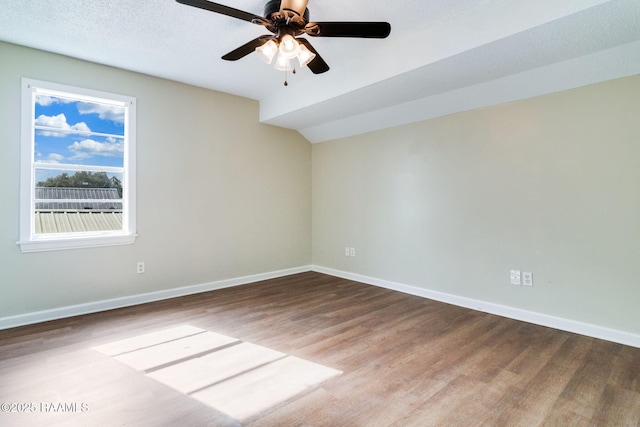 empty room featuring ceiling fan and hardwood / wood-style flooring