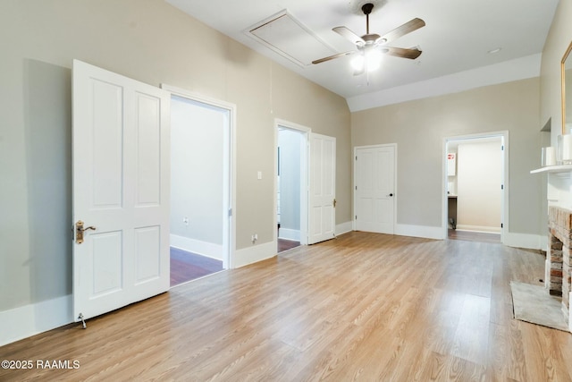 interior space with ceiling fan, light hardwood / wood-style floors, and ensuite bathroom