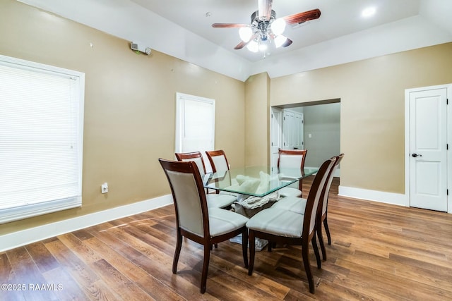 dining space featuring ceiling fan and hardwood / wood-style floors