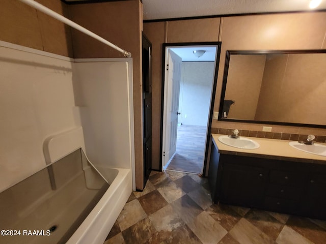 bathroom with shower / bathing tub combination and vanity