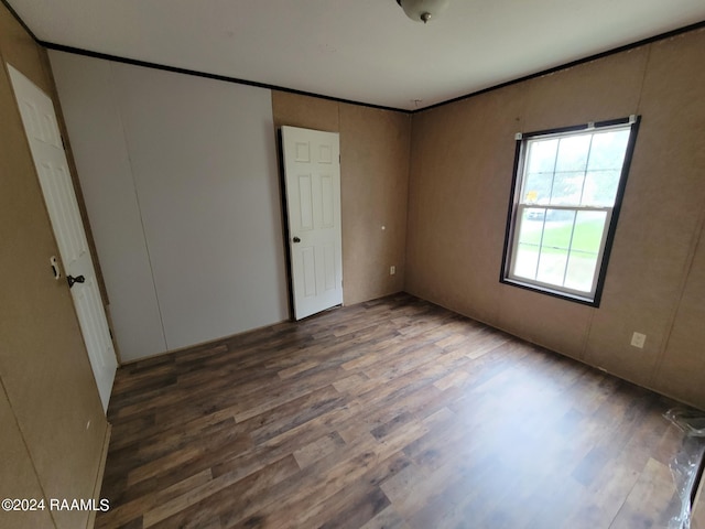 empty room featuring dark hardwood / wood-style flooring