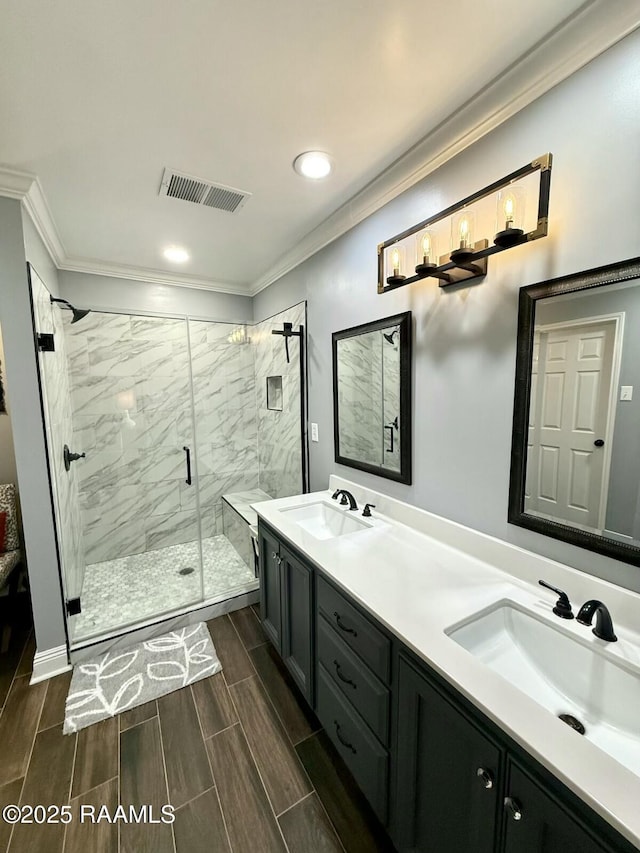 bathroom featuring ornamental molding, a shower with door, and vanity