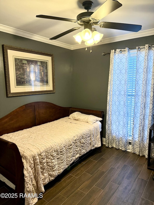 bedroom featuring ornamental molding and ceiling fan