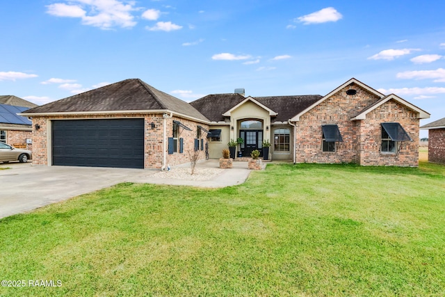 view of front of home featuring a garage and a front lawn