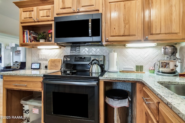 kitchen featuring tasteful backsplash, range with electric stovetop, and light stone countertops