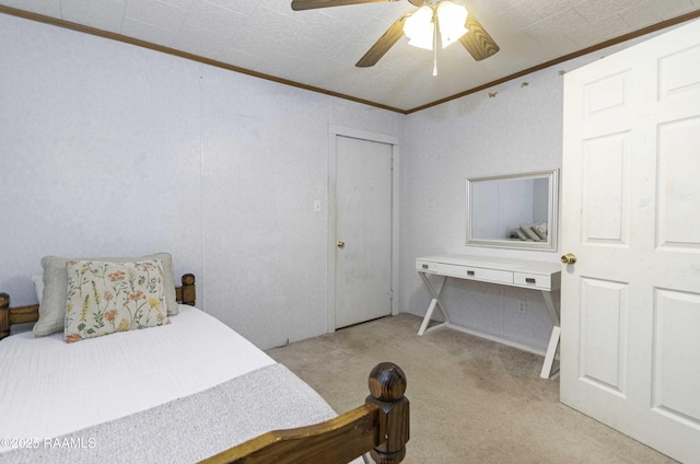 carpeted bedroom with ceiling fan and crown molding