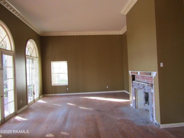 unfurnished living room featuring hardwood / wood-style floors and a fireplace