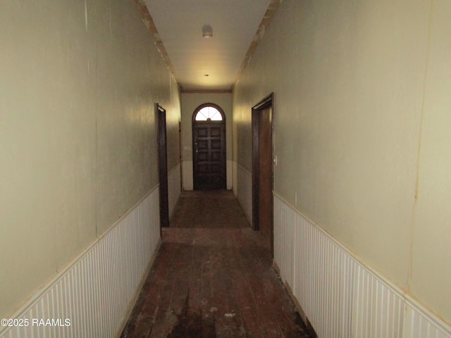 hallway with wood-type flooring