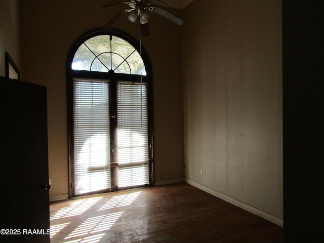 unfurnished room featuring ceiling fan and hardwood / wood-style flooring