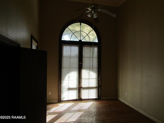 spare room featuring ceiling fan and hardwood / wood-style flooring