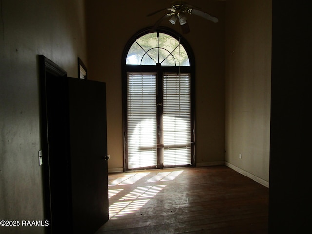 spare room featuring ceiling fan and hardwood / wood-style flooring