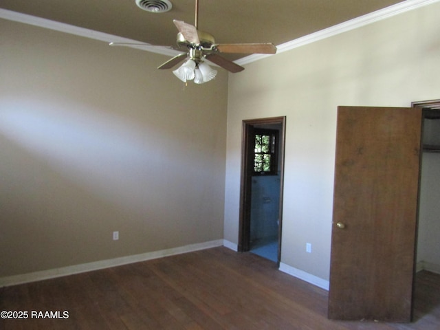 unfurnished bedroom with ceiling fan, dark wood-type flooring, and crown molding