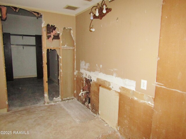 bathroom with crown molding and visible vents