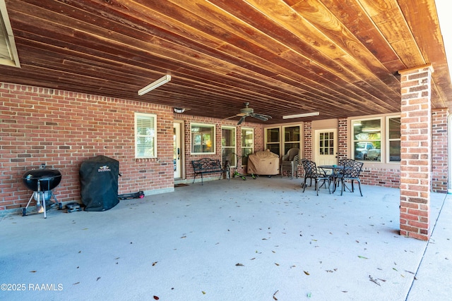 view of patio featuring a grill and a ceiling fan