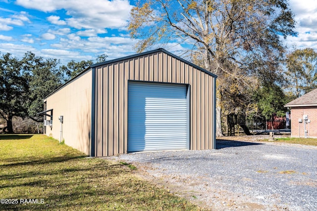 detached garage featuring driveway