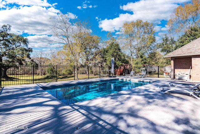 view of swimming pool with fence, a fenced in pool, and a patio