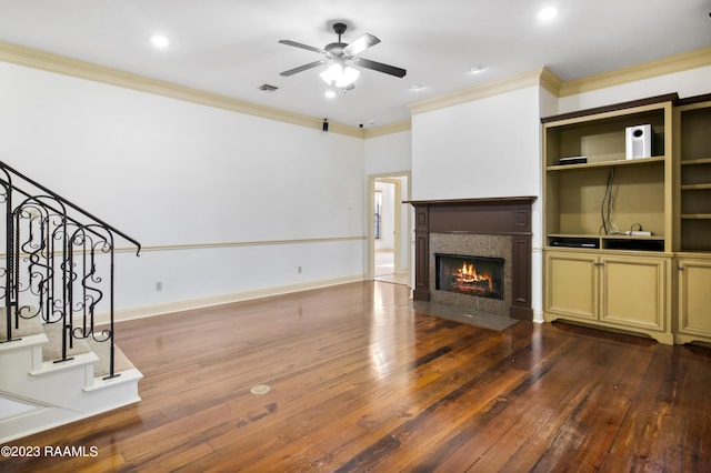 unfurnished living room with ceiling fan, ornamental molding, and hardwood / wood-style floors