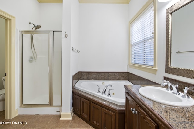 full bathroom with tile patterned floors, vanity, toilet, and separate shower and tub