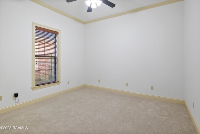 unfurnished room with light carpet, ceiling fan, and crown molding