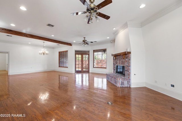 unfurnished living room with crown molding, hardwood / wood-style flooring, ceiling fan, beam ceiling, and a brick fireplace