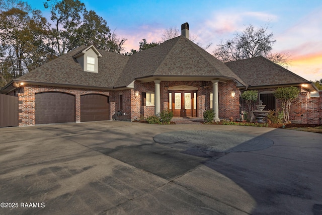 view of front of property with a garage