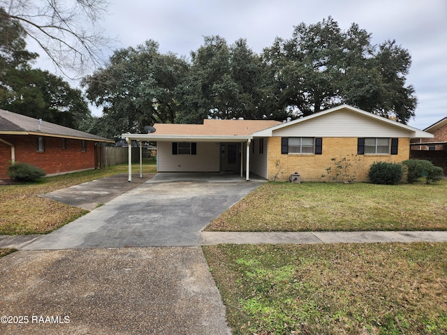 ranch-style house with a carport and a front lawn