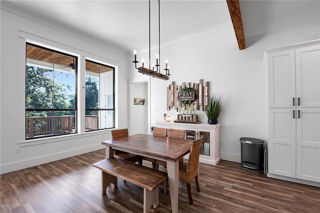 dining room featuring dark wood-style floors, baseboards, and a chandelier