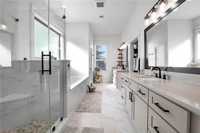 bathroom featuring a washtub, visible vents, vanity, marble finish floor, and a shower stall