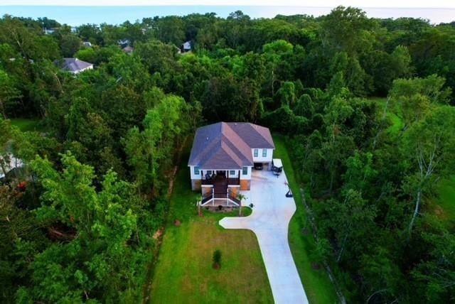 aerial view featuring a wooded view