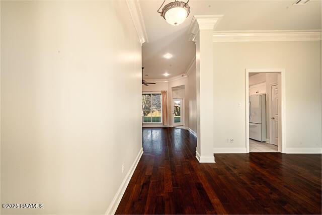 corridor featuring hardwood / wood-style flooring and ornamental molding