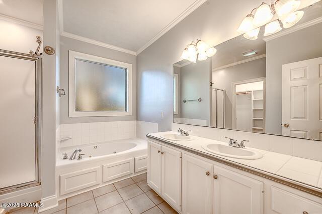 bathroom featuring crown molding, independent shower and bath, tile patterned flooring, and vanity