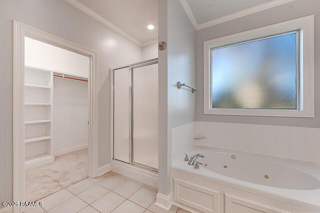 bathroom featuring crown molding, plus walk in shower, tile patterned floors, and a wealth of natural light