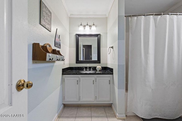 bathroom with tile patterned flooring, vanity, and ornamental molding