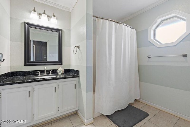 bathroom with vanity, ornamental molding, and tile patterned floors