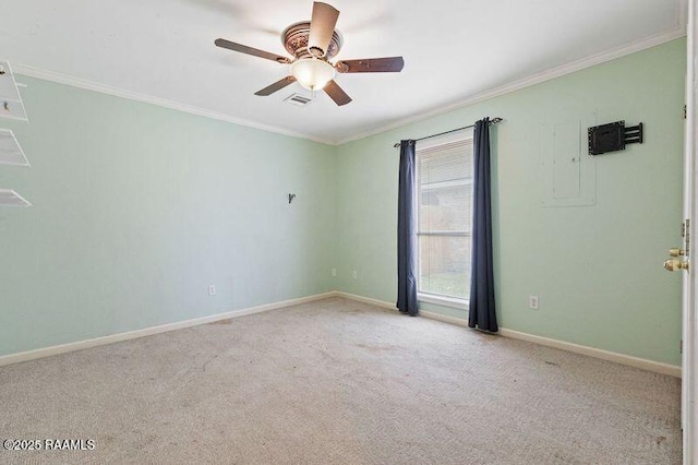 carpeted spare room with ornamental molding and ceiling fan