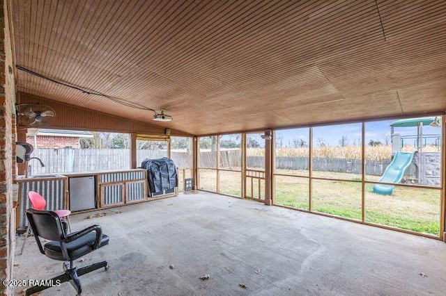 unfurnished sunroom with vaulted ceiling