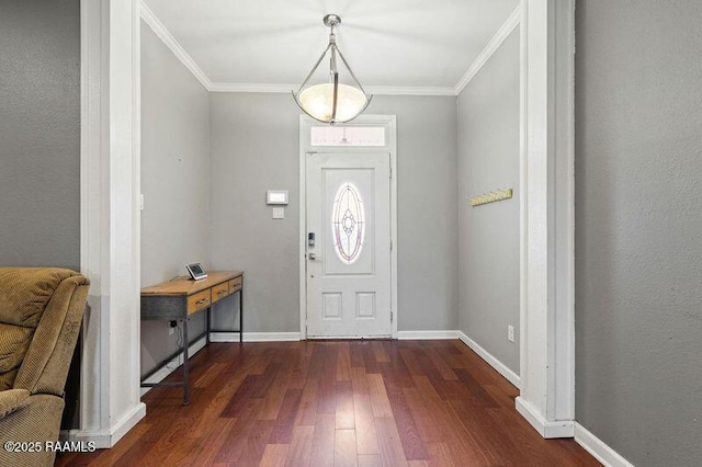 entryway with ornamental molding and dark hardwood / wood-style flooring