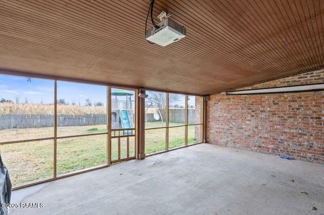 unfurnished sunroom with lofted ceiling