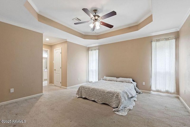 bedroom featuring multiple windows, light carpet, ornamental molding, and a raised ceiling