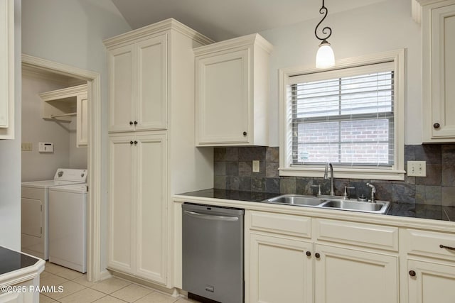 kitchen with stainless steel dishwasher, a wealth of natural light, sink, and light tile patterned floors