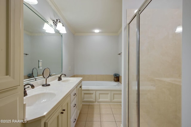 bathroom featuring a bath, crown molding, vanity, and tile patterned flooring