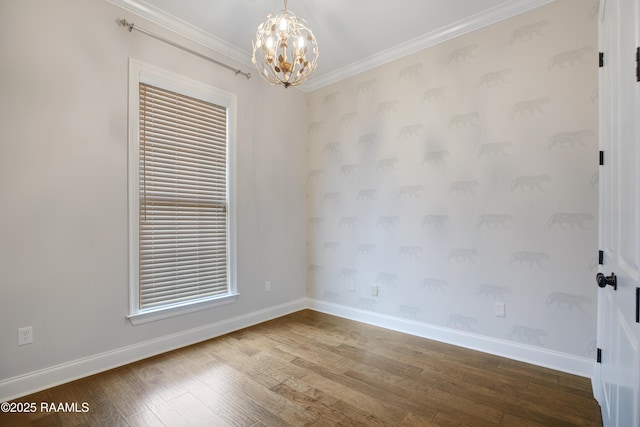 unfurnished room with wood-type flooring, a notable chandelier, and ornamental molding