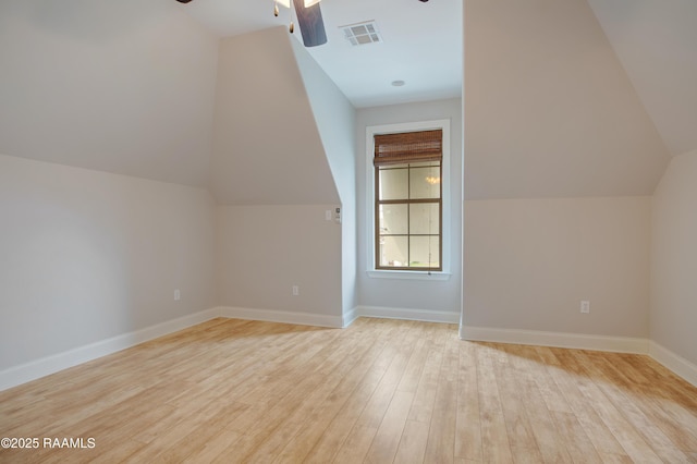 bonus room featuring ceiling fan, light hardwood / wood-style floors, and vaulted ceiling