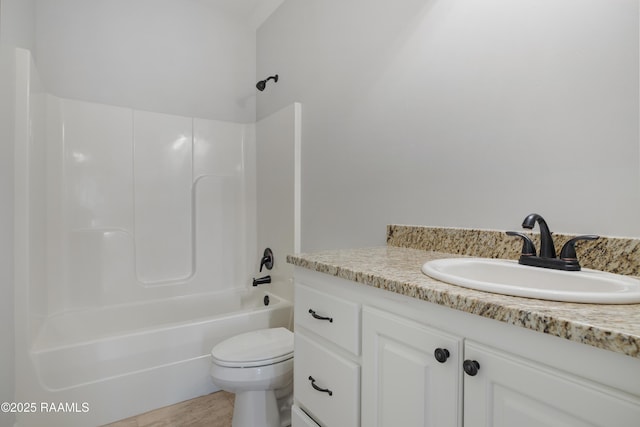 full bathroom featuring toilet, vanity, and shower / washtub combination