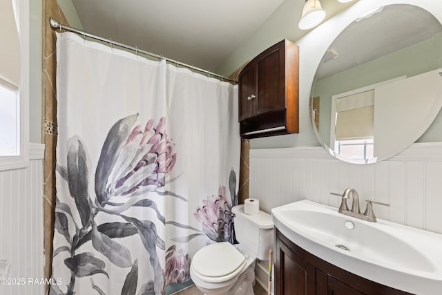 bathroom with vanity, toilet, and a shower with shower curtain