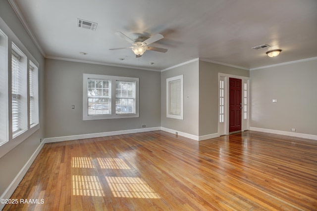 interior space featuring crown molding, light hardwood / wood-style flooring, and a wealth of natural light