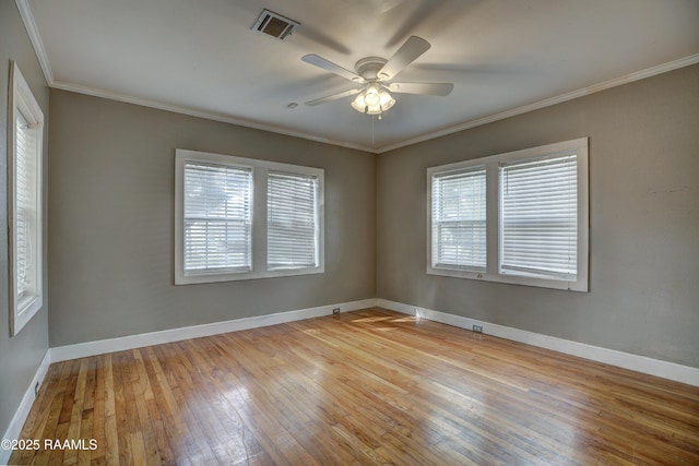 unfurnished room with crown molding, ceiling fan, and light hardwood / wood-style flooring