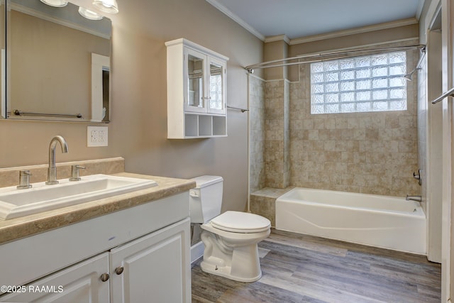 full bathroom with ornamental molding, hardwood / wood-style floors, vanity, and toilet